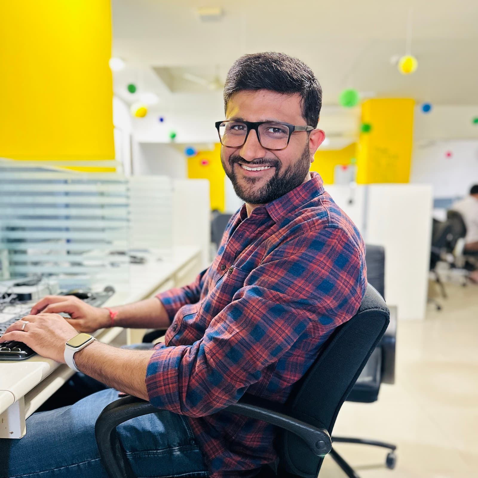 Anand Thakkar at his desk during his first IT job as a software developer, 2022